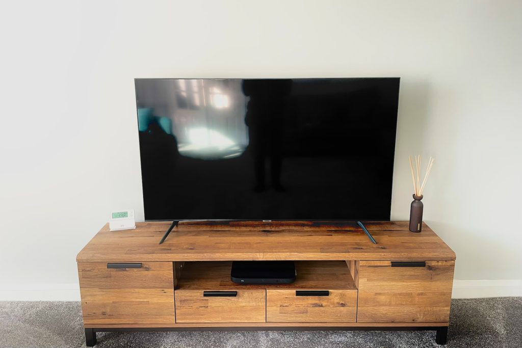 what is the best height for a 65-inch TV stand